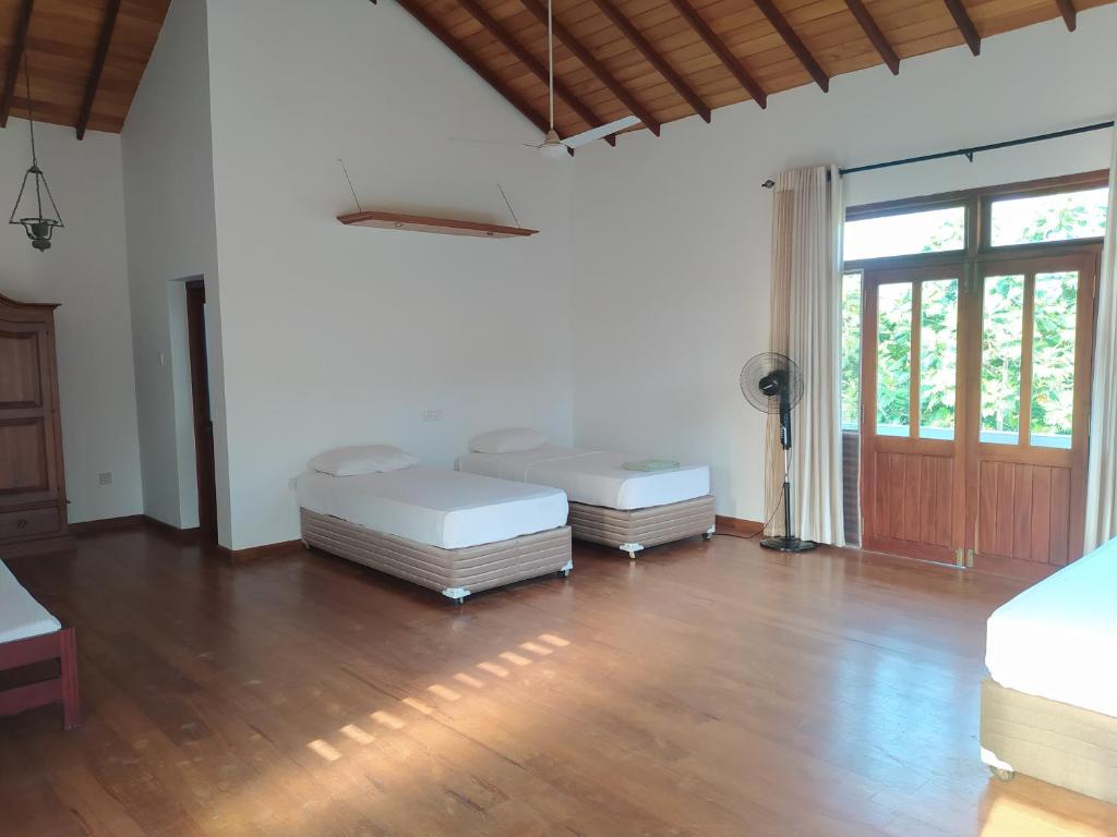 Postel nebo postele na pokoji v ubytování Hostel Residence Bentota