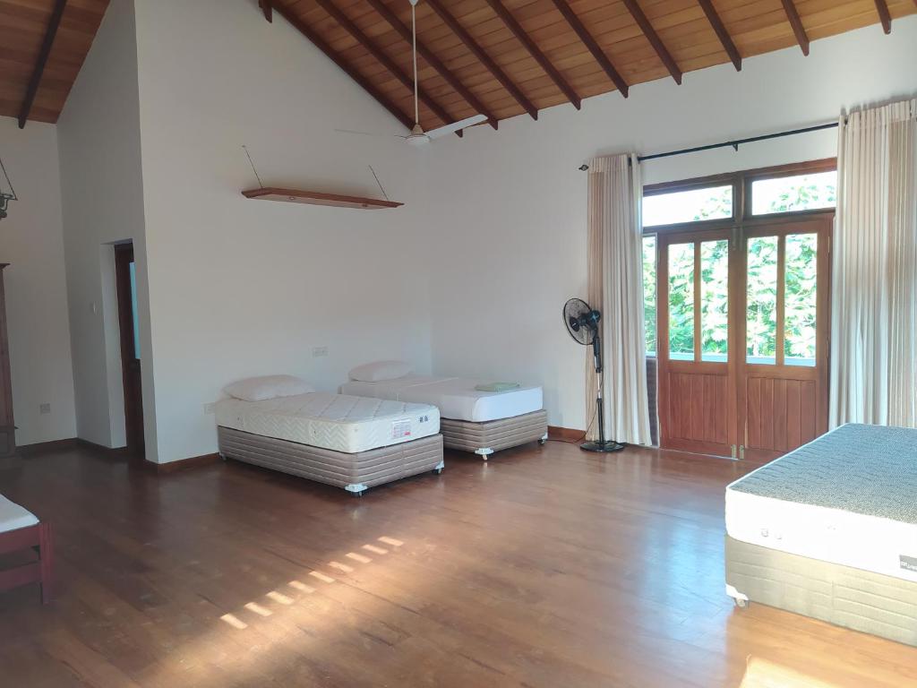 Postel nebo postele na pokoji v ubytování Hostel Residence Bentota