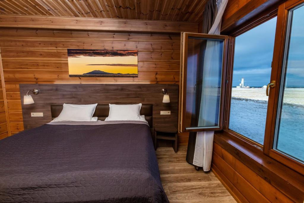Uma cama ou camas num quarto em Lighthouse-Inn