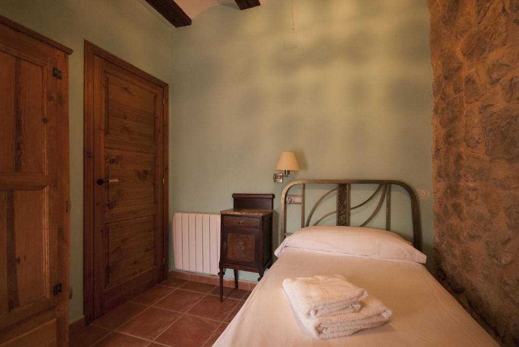 Cama o camas de una habitación en Apartamentos Doña Candida