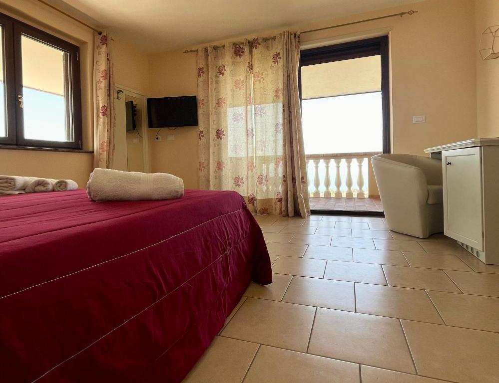 A bed or beds in a room at Residenza Domus Aurea Tropea- Vista Mare