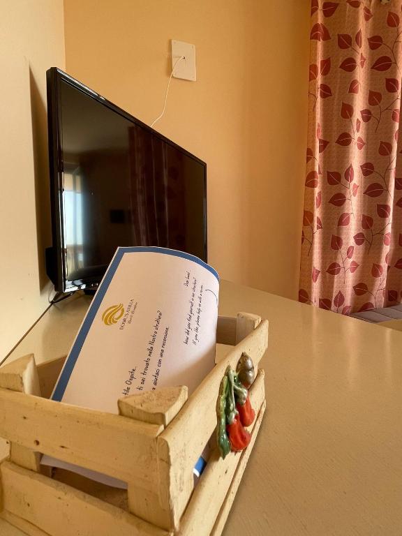 A television and/or entertainment centre at Residenza Domus Aurea Tropea- Vista Mare