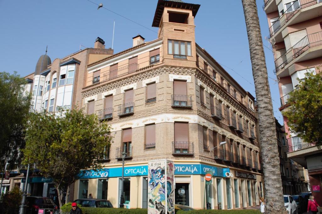 a building with a clock tower on top of it at Casa del Sol in Cieza