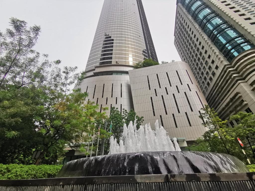 a water fountain in front of a tall building at Opus Bukit Bintang in Kuala Lumpur