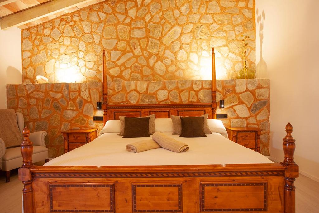 A bed or beds in a room at S'Hort de Son Caulelles - Adults Only
