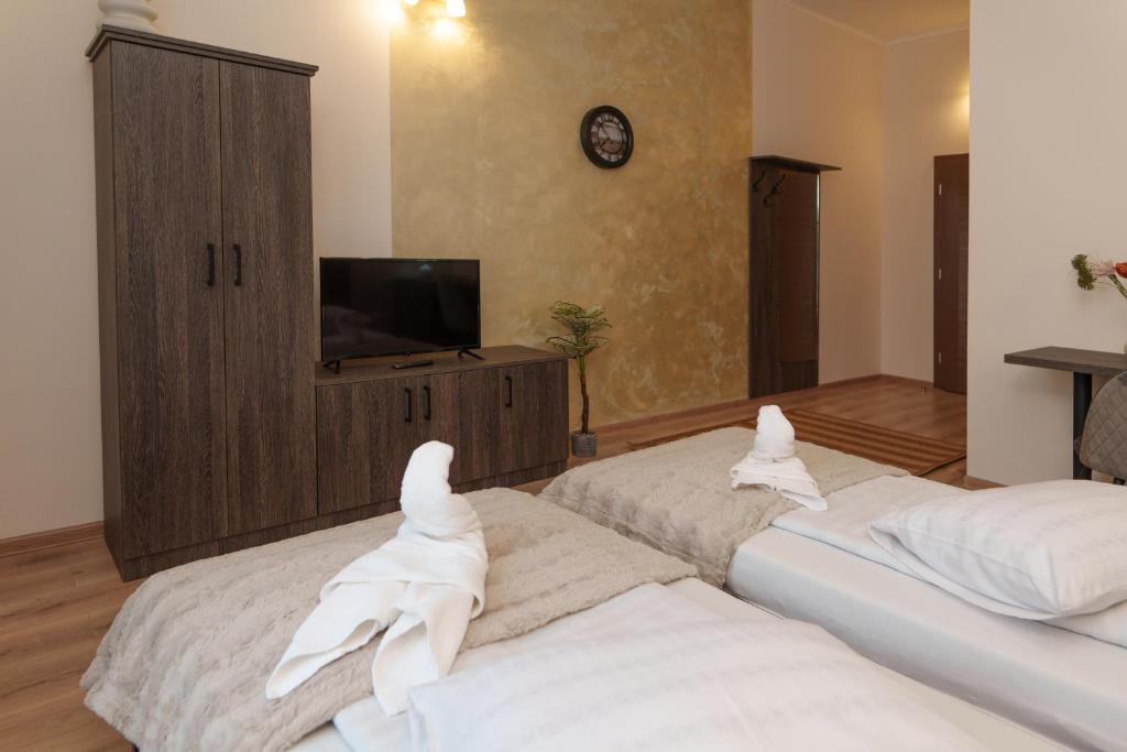Postel nebo postele na pokoji v ubytování Hotel Rubin***