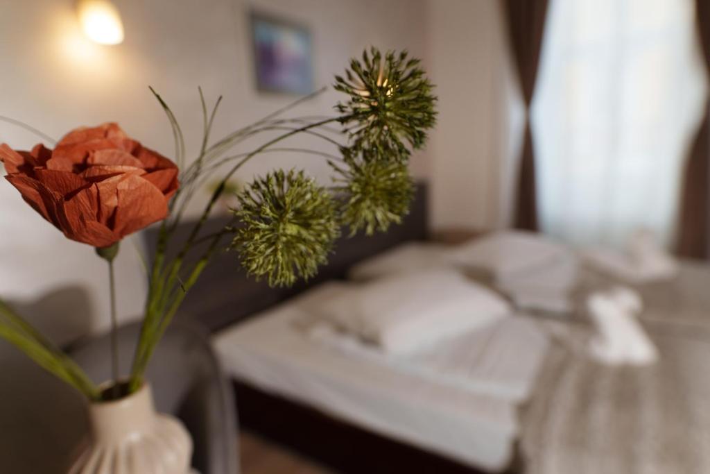 Postel nebo postele na pokoji v ubytování Hotel Rubin***