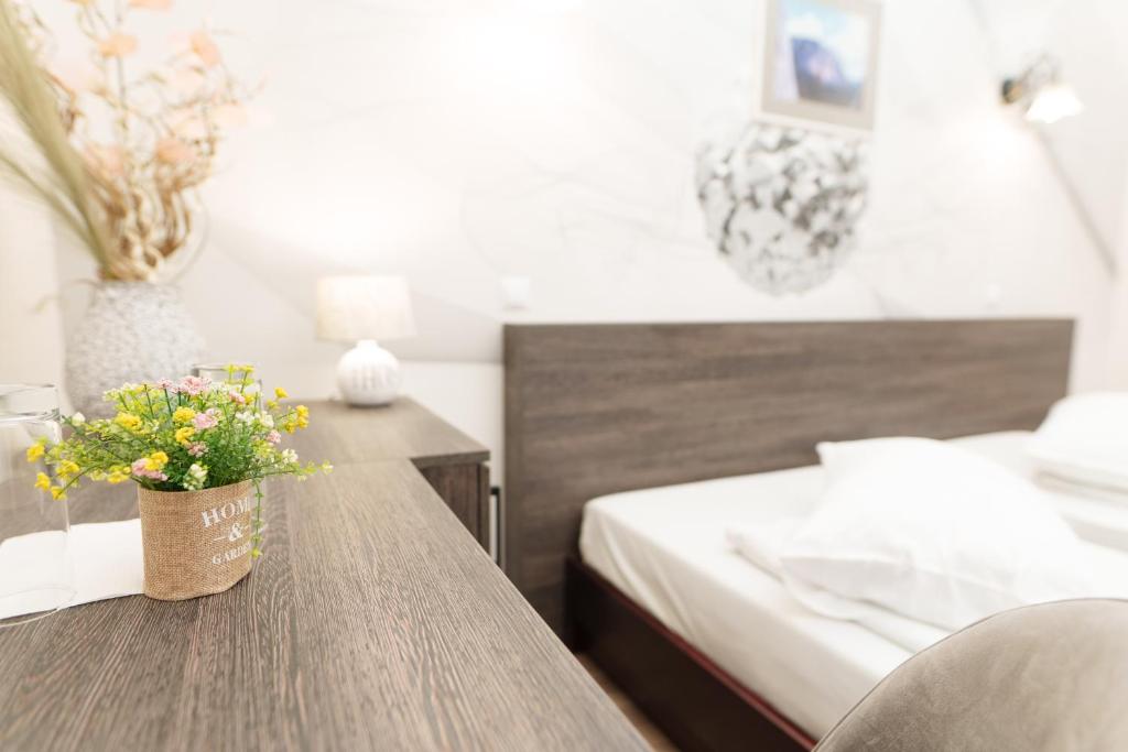 Postel nebo postele na pokoji v ubytování Hotel Rubin***