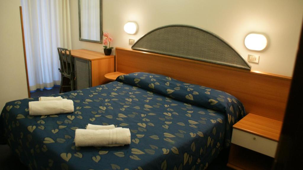 Postel nebo postele na pokoji v ubytování Hotel Verudella