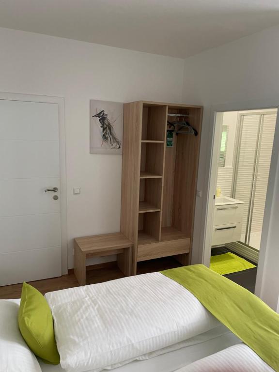 Postel nebo postele na pokoji v ubytování Hotel Garni Ilys Inn