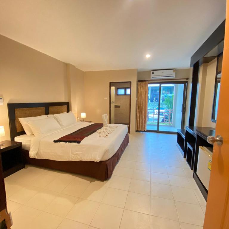 Postel nebo postele na pokoji v ubytování Du-sila Hotel kohchang