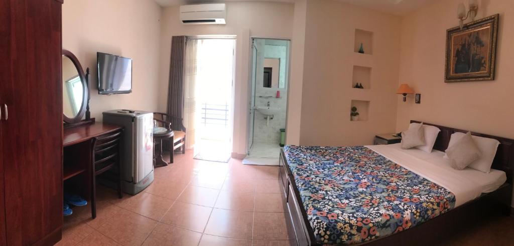 Postel nebo postele na pokoji v ubytování Kim Hotel