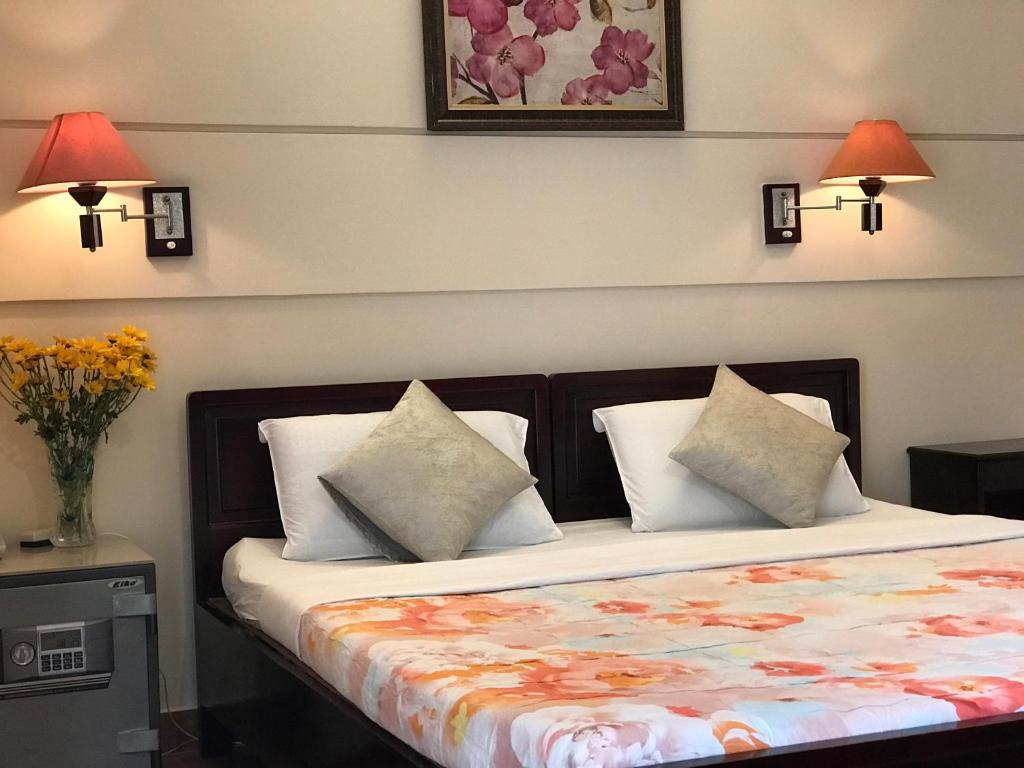 Postel nebo postele na pokoji v ubytování Kim Hotel