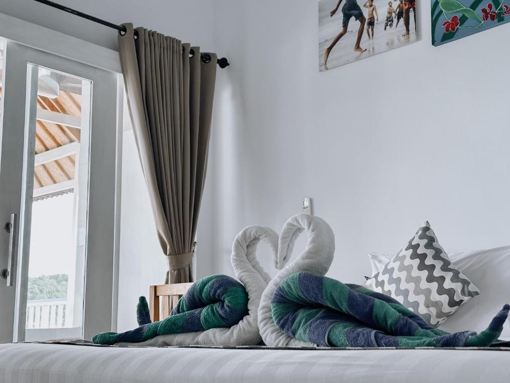 Postel nebo postele na pokoji v ubytování Aurora Beach View