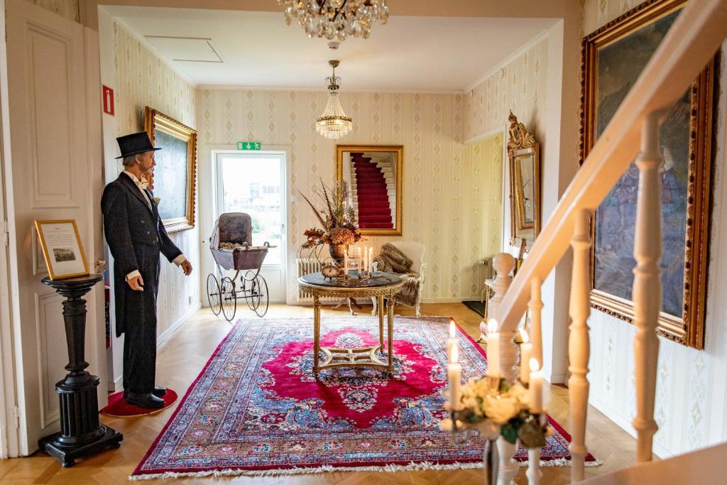 a man standing in the hallway of a house at Sweet Dreams B&B Ullared in Ullared