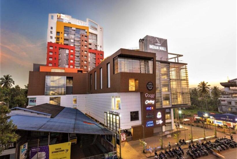 a building with a lot of motorcycles parked in front of it at THE TERRACE MANJERI in Manjeri