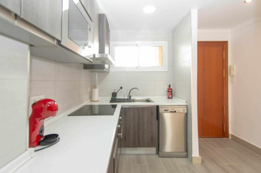 Kuchyňa alebo kuchynka v ubytovaní Apartamento con vistas al mar y al lado de todo