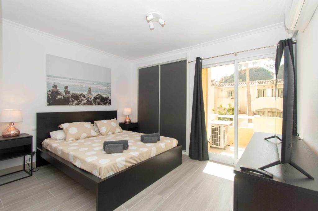Posteľ alebo postele v izbe v ubytovaní Apartamento con vistas al mar y al lado de todo