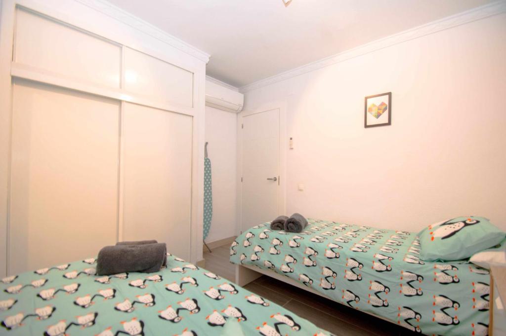 Posteľ alebo postele v izbe v ubytovaní Apartamento con vistas al mar y al lado de todo