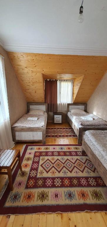 Postel nebo postele na pokoji v ubytování Betegi Guest House