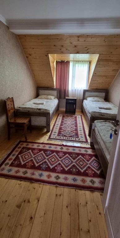 Postel nebo postele na pokoji v ubytování Betegi Guest House
