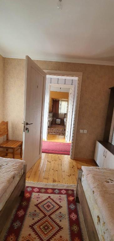 Postel nebo postele na pokoji v ubytování Betegi Guest House