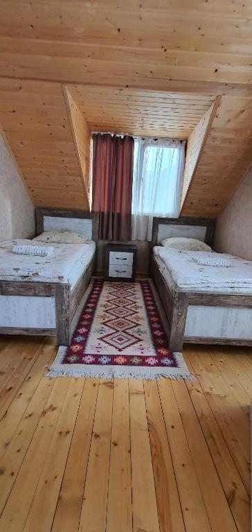 Postel nebo postele na pokoji v ubytování Betegi Guest House