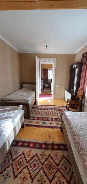 Postel nebo postele na pokoji v ubytování Betegi Guest House