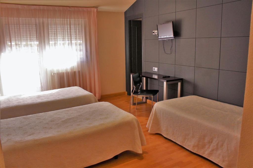 Postel nebo postele na pokoji v ubytování Hotel Area Serrano