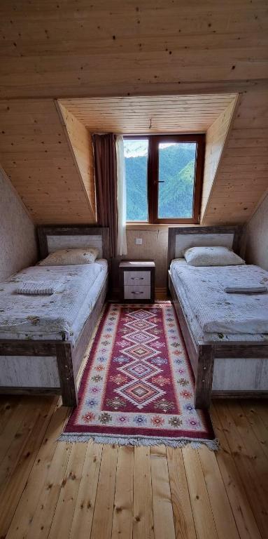 Postel nebo postele na pokoji v ubytování Betegi Guest House