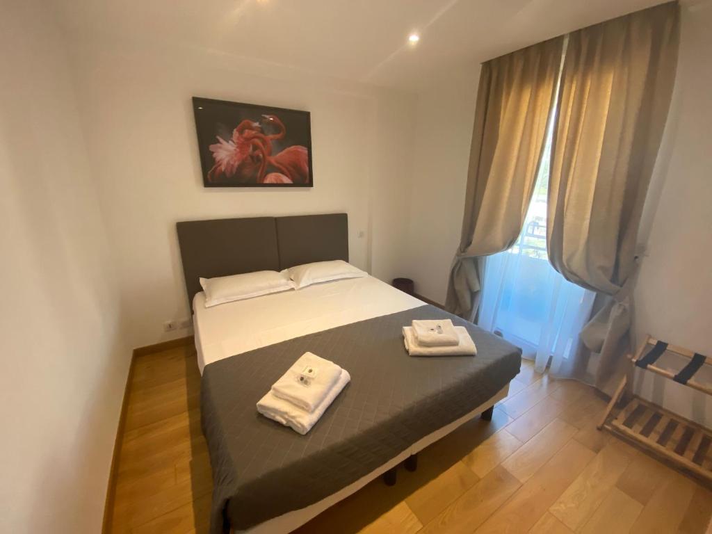 Postel nebo postele na pokoji v ubytování Riviera Eden Palace