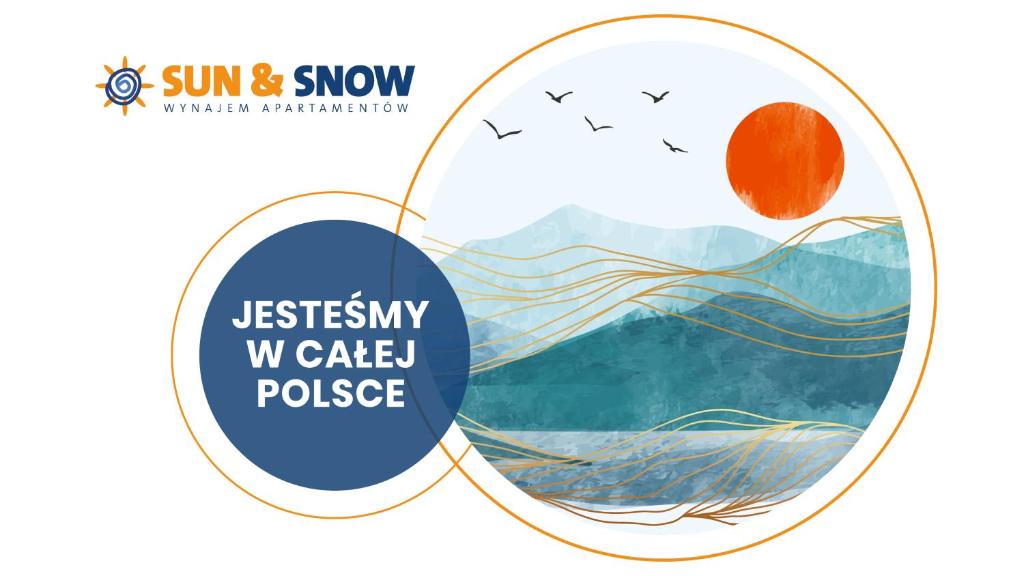 コウォブジェクにあるApartamenty Sun & Snow Morska Portの太陽のロゴを付けた円の写真