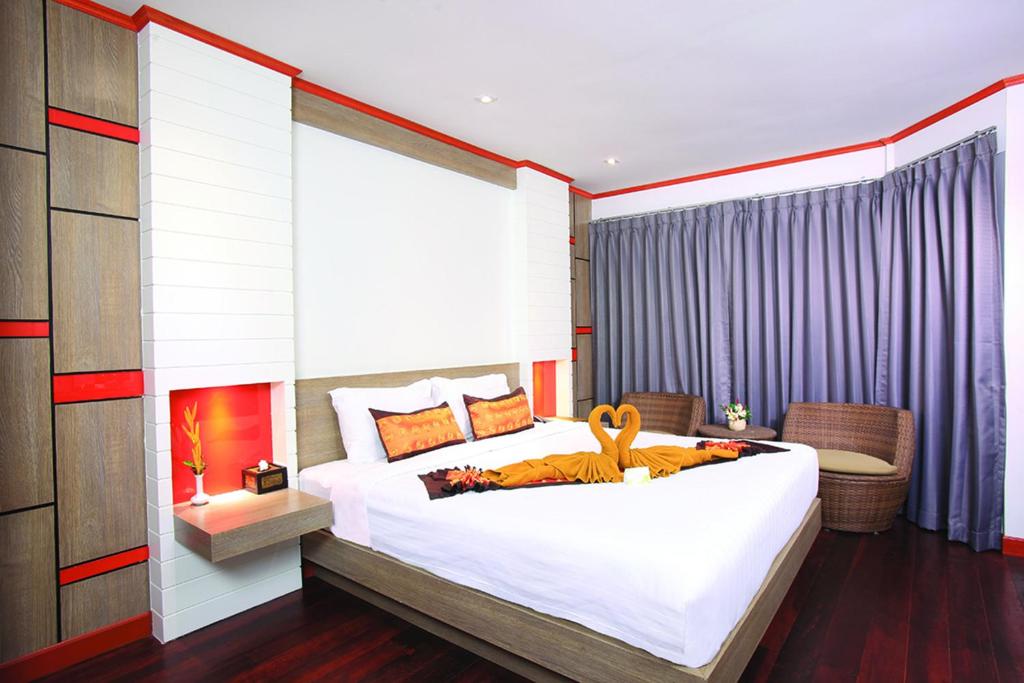A bed or beds in a room at Phi Phi Natural Resort