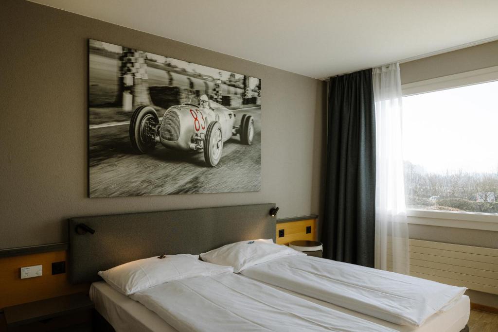 Postel nebo postele na pokoji v ubytování Hotel A1 Grauholz