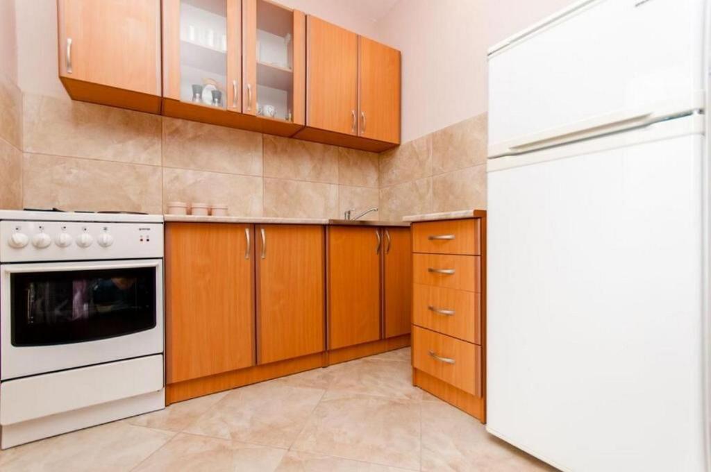 Kuchyň nebo kuchyňský kout v ubytování Apartments Mladen