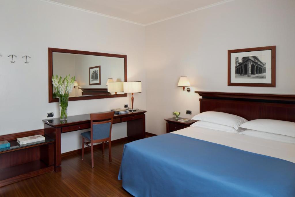Postel nebo postele na pokoji v ubytování Starhotels Excelsior