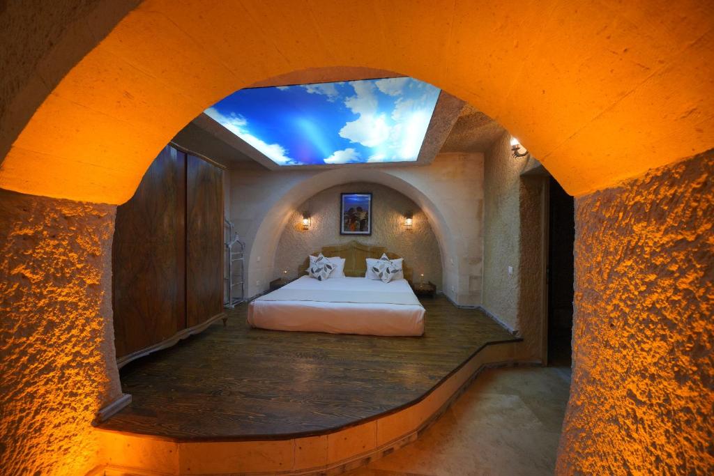 Postel nebo postele na pokoji v ubytování Karlık Cave Suite Cappadocia
