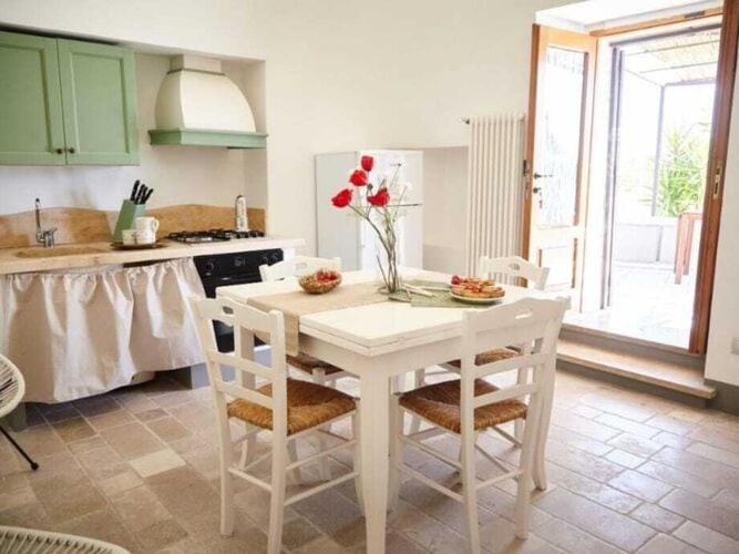 A kitchen or kitchenette at Historic Trulli Azzalema in Cisternino