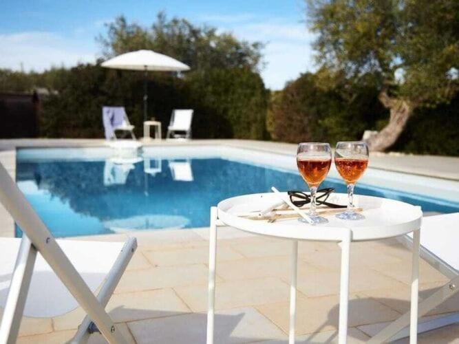 The swimming pool at or close to Historic Trulli Azzalema in Cisternino