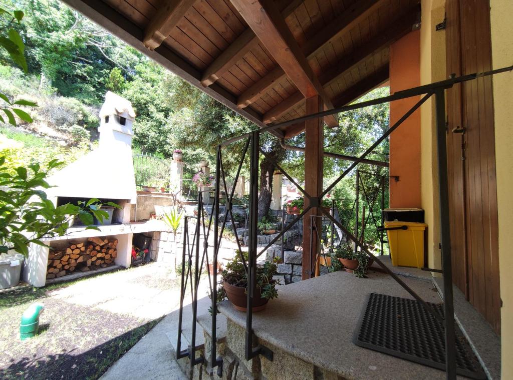 an outside view of a house with a patio at S'Iscala apartment in Lanusei