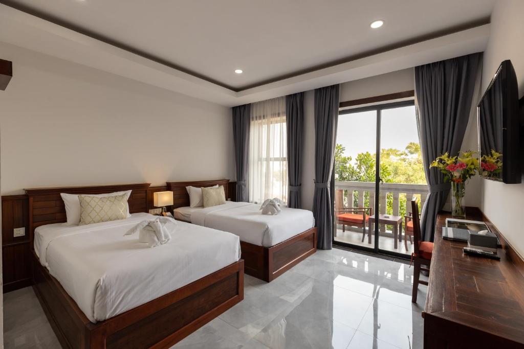 Postel nebo postele na pokoji v ubytování Blanc Smith Hotel
