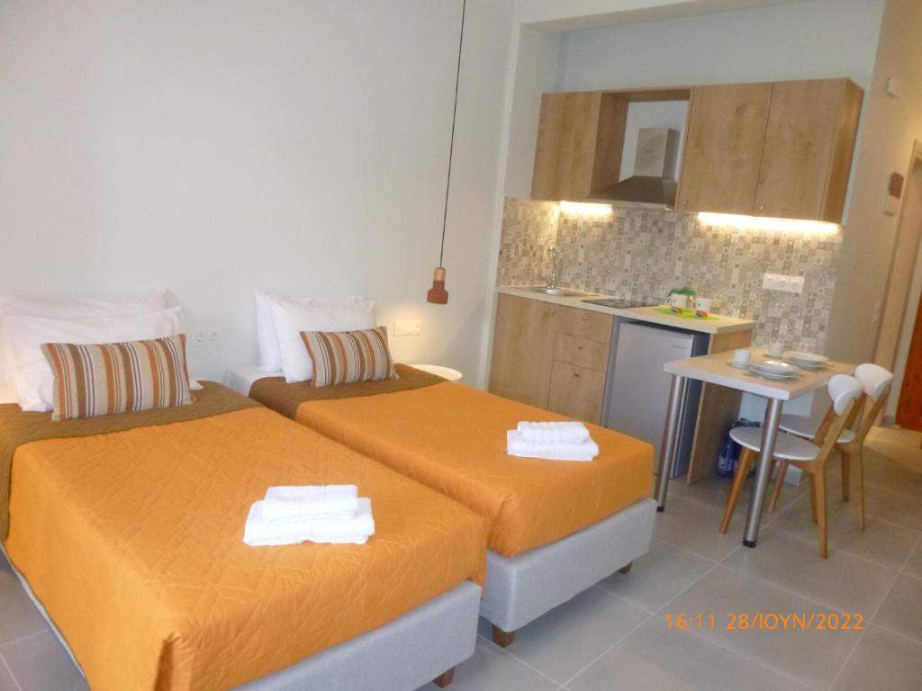 En eller flere senge i et v&aelig;relse p&aring; Niki Studios and Apartments By Hotelius