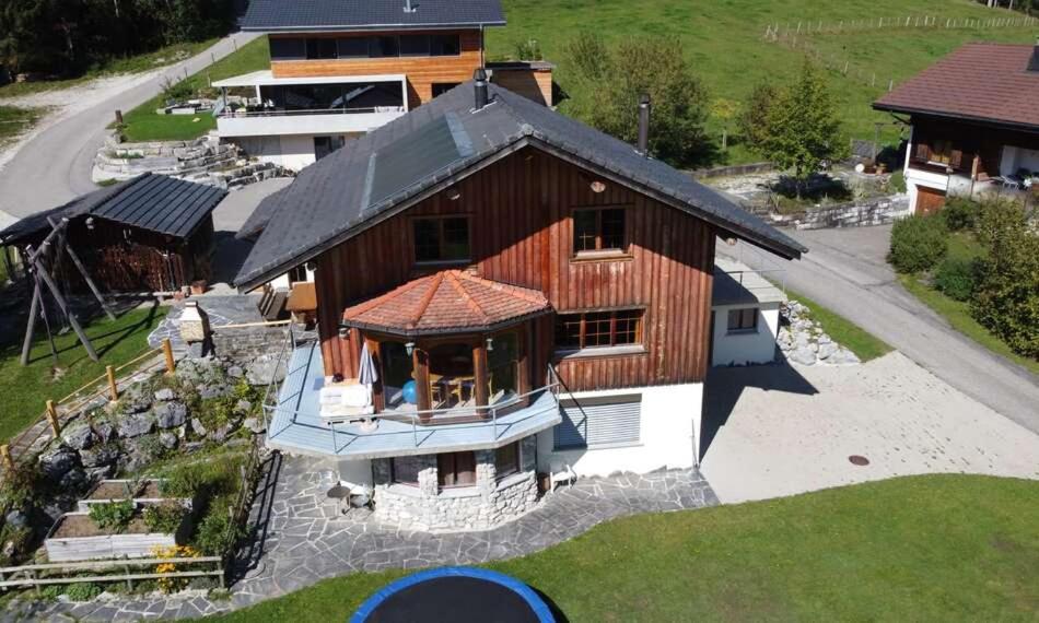 an overhead view of a large house with at BnB Försterlodge in Schwarzsee