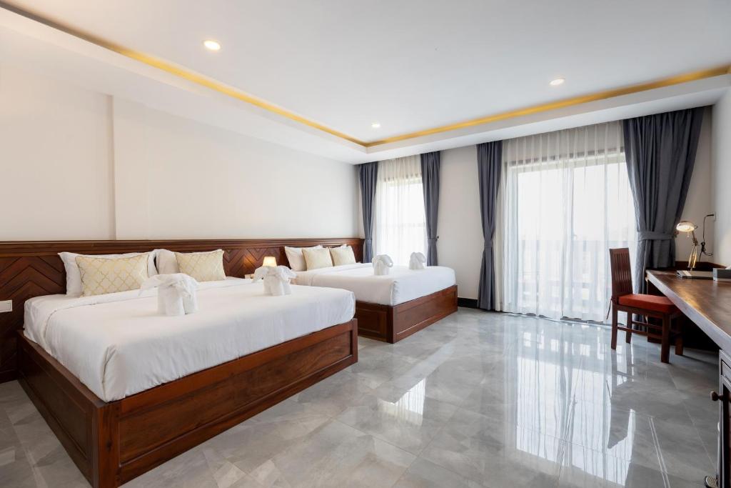 Postel nebo postele na pokoji v ubytování Blanc Smith Hotel