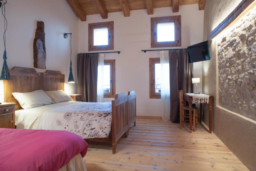 Postel nebo postele na pokoji v ubytování Agriturismo Casaborgomarche