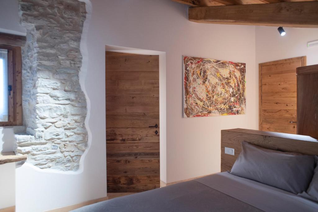 Postel nebo postele na pokoji v ubytování Agriturismo Casaborgomarche