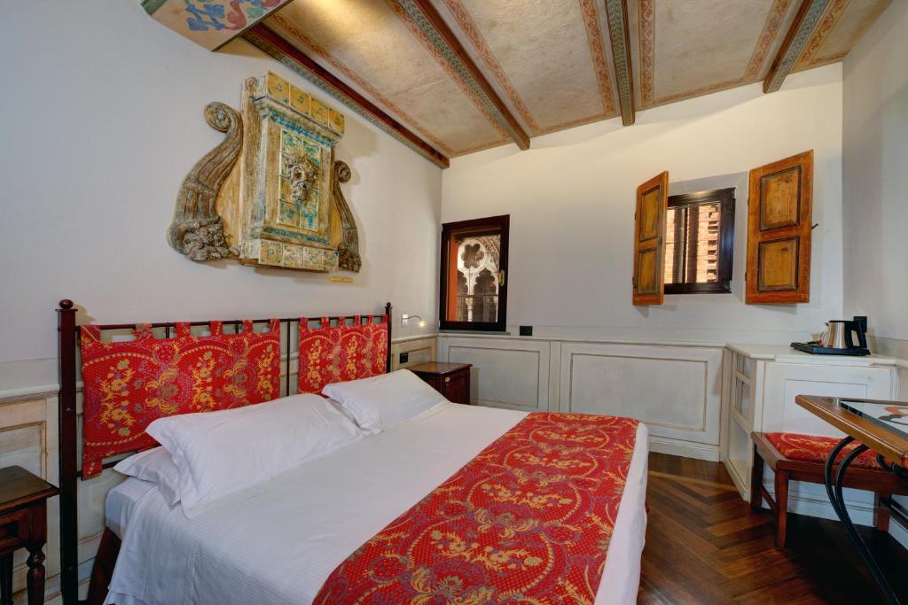 Posteľ alebo postele v izbe v ubytovaní Art Hotel Commercianti