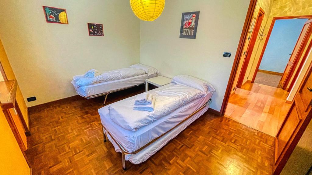 A bed or beds in a room at Appartamento Des Amis - Affitti Brevi Italia