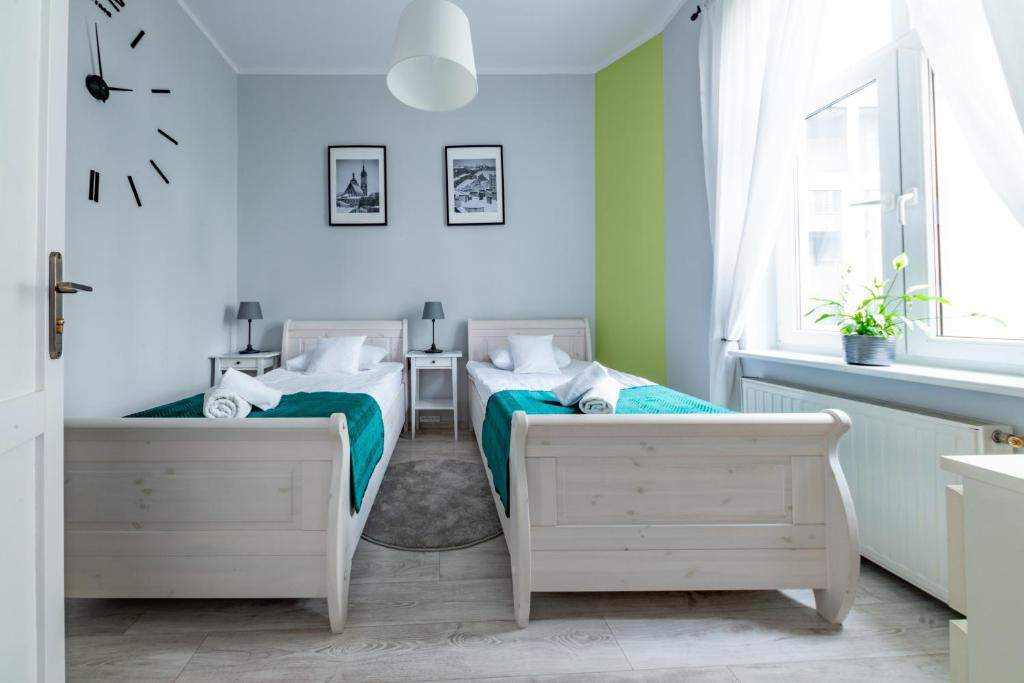 Posteľ alebo postele v izbe v ubytovaní Wawel Castle Apartment