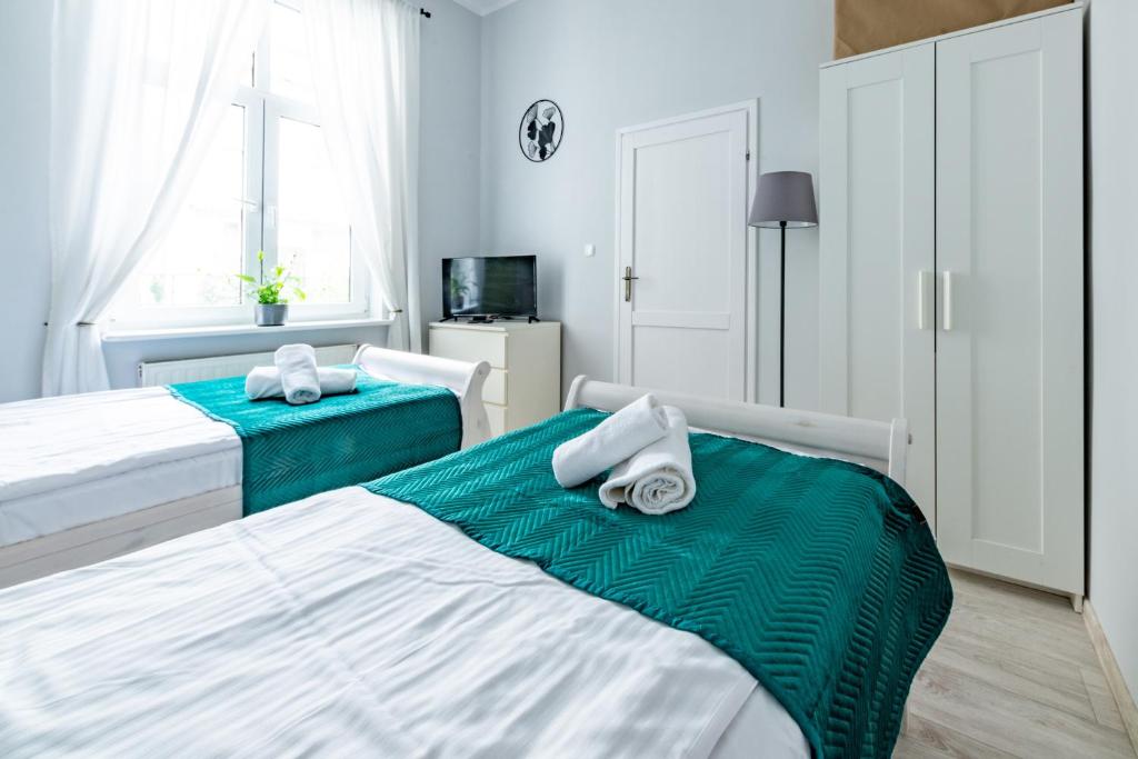 Posteľ alebo postele v izbe v ubytovaní Wawel Castle Apartment